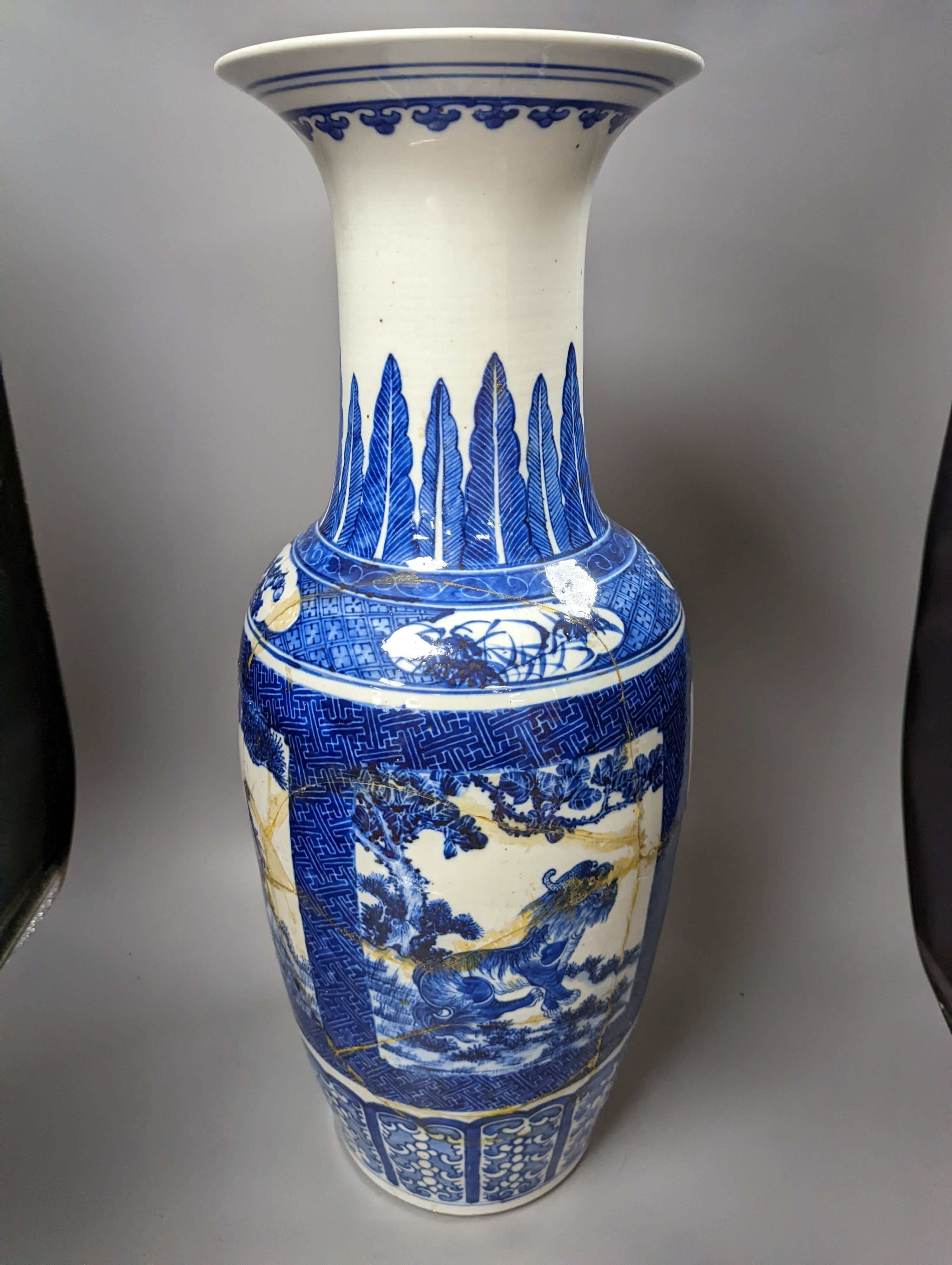 A pair of large early 20th century Chinese Blue and white ‘mythical beast’ vases, 60 cms high.
